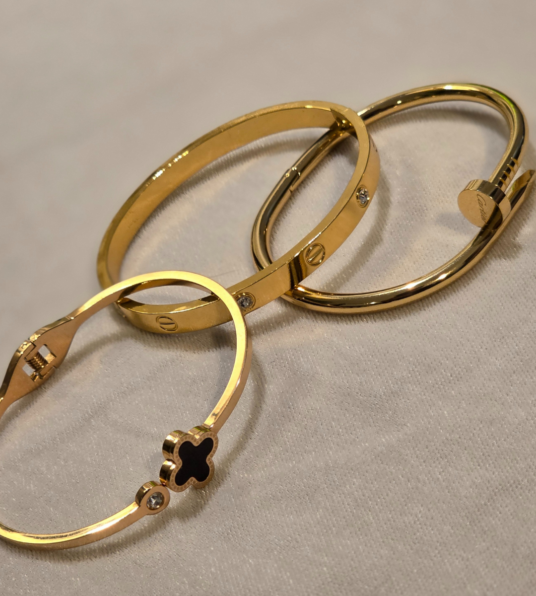 Trio Stack of Cartier Love & Nail Bangle With Black Clover Bangle
